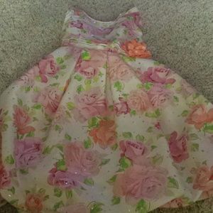 Floral garden dress with billowed skirt and a rose